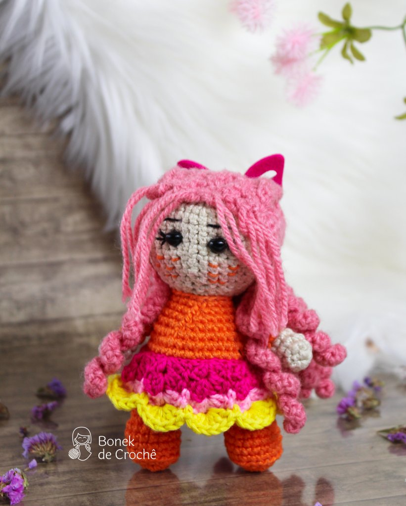 Molly is a unique, beautiful and smart, hand knit doll soft colorful yarn, filled with non-allergenic of holofiber.