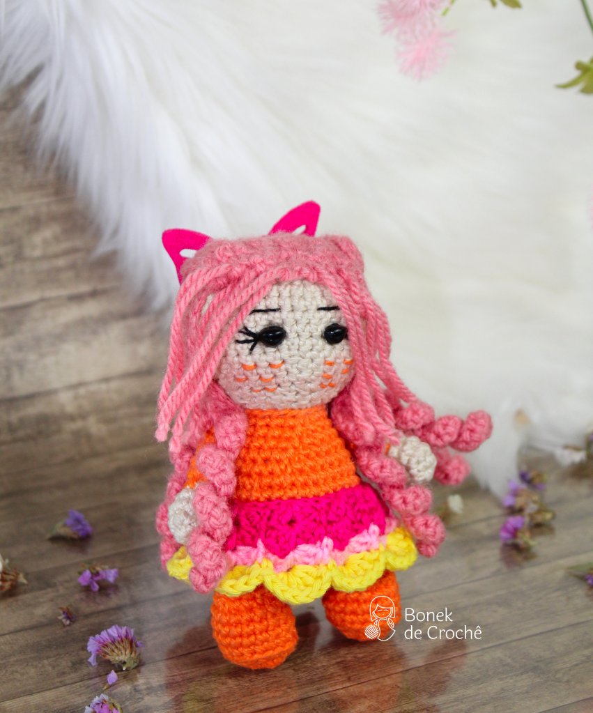 Molly is a unique, beautiful and smart, hand knit doll soft colorful yarn, filled with non-allergenic of holofiber.